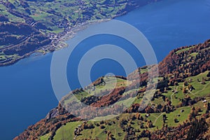 Lake Walensee and colorful forest. Walenstadtberg. View from Chaeserrugg. Autumn scene in Switzerland.