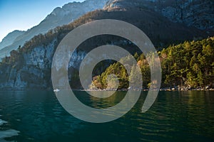 Beautiful view of Lake Walensee (Lake Walen or Lake Walenstadt) with mountain range in background. Switzerland, Europe photo