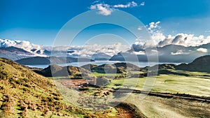 Lake Wanaka and the Southern Alps viewed from the slopes of Mount Roy on the way up the picturesque Roys Peak