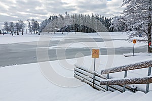 Lake with warning sign Thin Ice