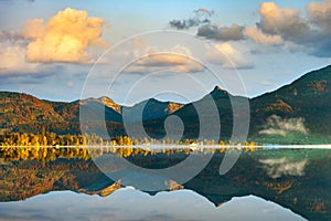 Lake wolfgangsee, austria On the mornings of autumn Mountains and trees reflect in the still water