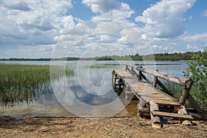 lake and wooden footbridge landscape .