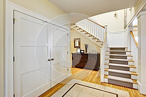 Lakefront home foyer with staircase