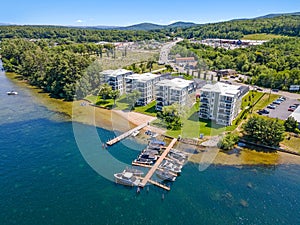 lakeside apartments with boats at dock, in Lakeport New Hampshire.