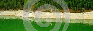 Lakeside forest forrest pine trees reflection in mountain lake autumn fall