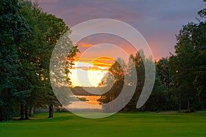 Lakeside golf course at sunset