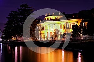 Lakeside mansion at night