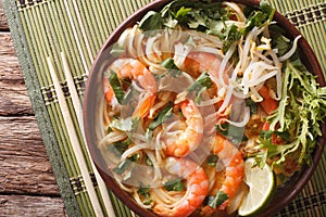 Laksa soup with shrimps, noodles, sprouts and coriander in a bow