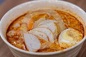 Laksa is a spicy noodle soup popular in Peranakan cuisine of Southeast Asia