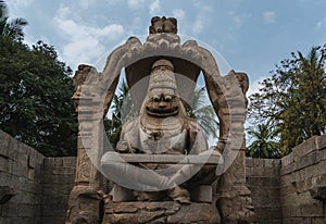 Lakshmi Narasimha Temple or Statue of Ugra Narsimha, Hampi karnakata india with cloudy sky photo