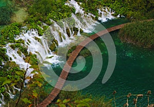 Lalake in forest with waterfall of national park Plitvice, Croatiarain