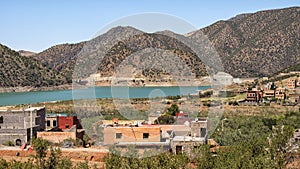 Lalla Takerskout Lake formed by a dam on the Nfis River in the Ouirgane Valley in the High Atlas Mountains of Morocco.