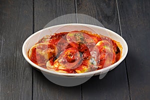 Lamb dumplings with tomato sauce baked in oven