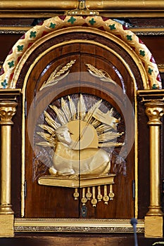 Lamb of God, tabernacle on the main altar in the Church of Our Lady of Seven Sorrows in Veliko Trgovisce, Croatia photo