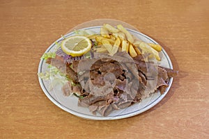 Lamb kebab plate with french fries and salad for pakistani