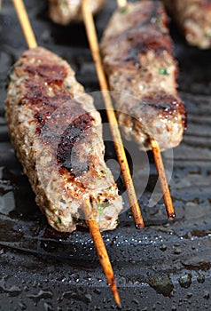 Lamb Kofta on a grill plate vertical