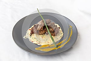 Lamb meat with sauce in plate
