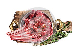 Lamb mutton chop steak, raw meat cutlet in a skillet with herbs. Isolated, white background.