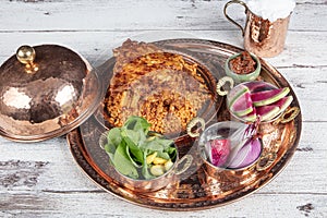 Lamb ribs on bulgur pilaf. Stuffed Ribs isolated on black background. Turkish name;