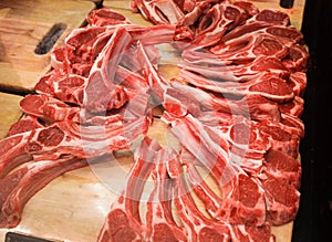 Lamb ribs, raw meat, piled in bulk, in supermarket
