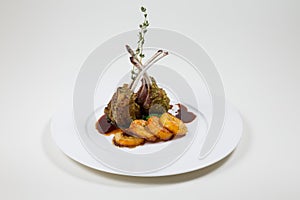 Lamb Ribs on a white plate on a white background