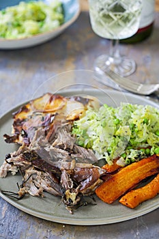 Lamb shoulder with dauphinoise potatoes, Savoy cabbage and roast carrots