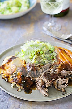 Lamb shoulder with dauphinoise potatoes, Savoy cabbage and roast carrots