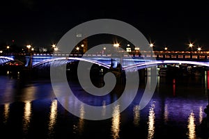 Lambeth bridge illuminated river thames