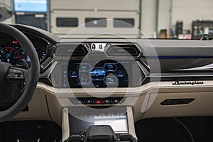 Lamborghini Urus cockpit in workshop with hex vents and controls