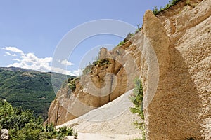 Lame Rosse in the Sibillini`s mountains. Stratifications of rock in the shape of pinnacles and towers consisting of gravel held