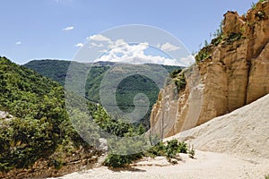 Lame Rosse in the Sibillini`s mountains. Stratifications of rock in the shape of pinnacles and towers consisting of gravel held