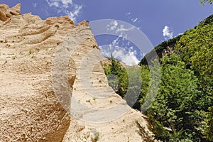 Lame Rosse in the Sibillini`s mountains. Stratifications of rock in the shape of pinnacles and towers consisting of gravel held