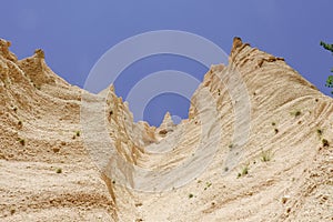 Lame Rosse in the Sibillini`s mountains. Stratifications of rock in the shape of pinnacles and towers consisting of gravel held