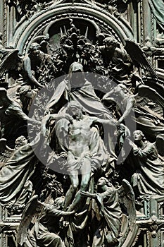 Lamentation of Christ, detail of the main bronze door of the Milan Cathedral photo