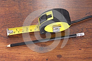 Laminate and tape measure and pencil