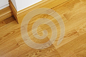 Laminate wooden flooring and skirting boards