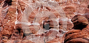 Laminated sandstone in Petra, Jordan, with strong red, yellow, orange and brown colours