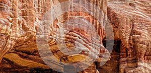 Laminated sandstone in Petra, Jordan, with strong red, yellow, orange and brown colours