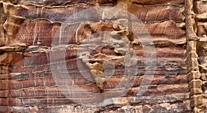 Laminated sandstone in Petra, Jordan, with strong red, yellow, orange and brown colours