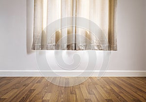 Laminated wood floor with white wall, with curtain