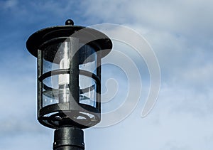 Lamp against the cloudy skies