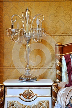 Lamp and bedding in golden decoration