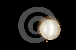 Lamp at black background. light bulb in the dark. Waterproof lamp for sauna. retro style decoration
