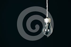 Lamp bulb hanging on the rope. New idea concept