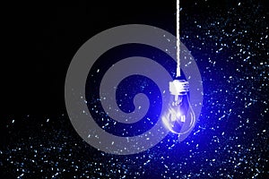 Lamp bulb hanging on the rope. New idea concept. Blue spots