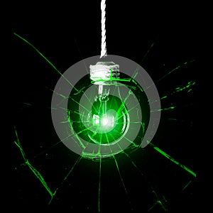 Lamp bulb hanging on the rope. New idea concept. Green shadows