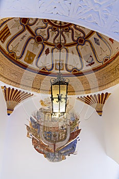 Lamp and decorated ceiling MondragÃÂ³n Palace Ronda Spain photo