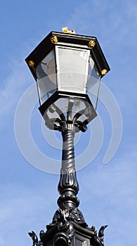 Lamp on fence on sky background at Buckingham Palace.