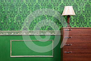 Lamp on furniture in green vintage interior photo