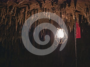 Lamp hanging in Cave Nature explorer Archeology discover